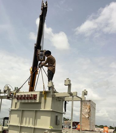 Transformer being lifted at a site